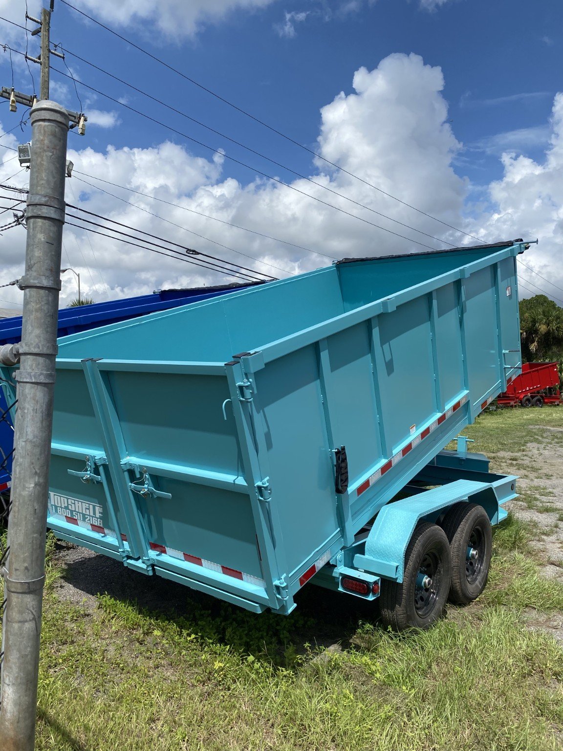 Rear view of aqua dump trailer