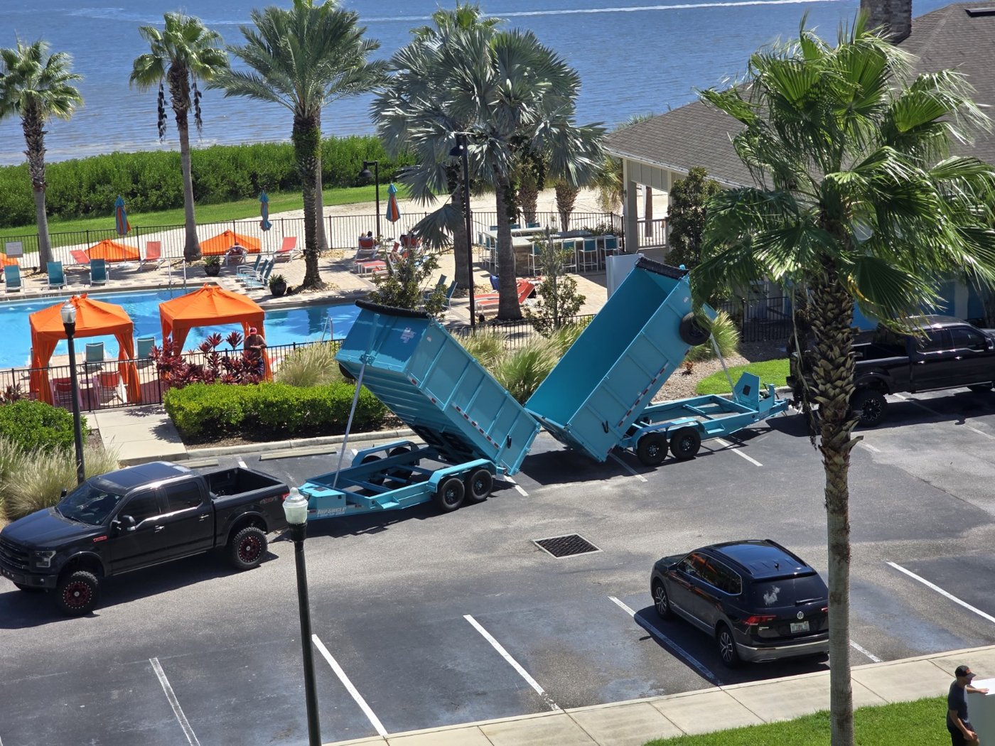 Family Roots Hauling aqua dump trailers with a black pickup truck